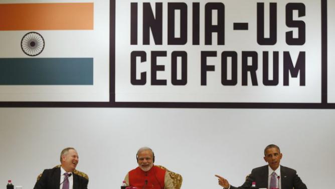 Honeywell CEO Cote and India's Prime Minister Modi laugh at a remark by U.S. President Obama during a CEO Roundtable and Forum at the India U.S. Business Summit in New Delhi