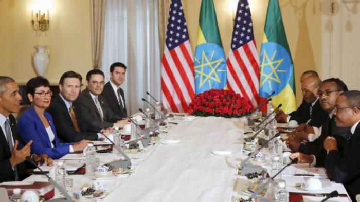 REFILE - UPDATING SLUG U.S. President Barack Obama (L) and his delegation sit down to a bilateral meeting with Ethiopia's Prime Minister Hailemariam Desalegn (R) at the National Palace in Addis Ababa, Ethiopia July 27, 2015. The economy of Ethiopia is forecast to expand by more than 10 percent, although rights groups say Addis Ababa's achievements are at the expense of political freedom. REUTERS/Jonathan Ernst