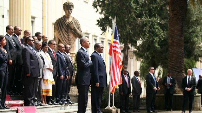 U.S. President Barack Obama (C) and his delegation, stand during welcome ceremony with Ethiopia's Prime Minister Hailemariam Desalegn (R) at the National Palace in Addis Ababa, Ethiopia July 27, 2015. The economy of Ethiopia is forecast to expand by more than 10 percent, although rights groups say Addis Ababa's achievements are at the expense of political freedom.REUTERS/Tiksa Negeri