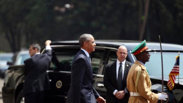 U.S. President Barack Obama (C) walks to review a marsh band during a welcome ceremony at the National Palace in Addis Ababa, Ethiopia July 27, 2015. The economy of Ethiopia is forecast to expand by more than 10 percent, although rights groups say Addis Ababa's achievements are at the expense of political freedom. REUTERS/Tiksa Negeri