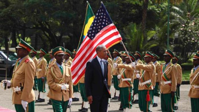 U.S. President Barack Obama (C) reviews a marsh band during a welcome ceremony at the National Palace in Addis Ababa, Ethiopia July 27, 2015. The economy of Ethiopia is forecast to expand by more than 10 percent, although rights groups say Addis Ababa's achievements are at the expense of political freedom. REUTERS/Tiksa Negeri