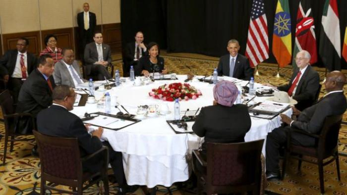 U.S. President Barack Obama holds a meeting on South Sudan and counterterrorism issues with African heads of state at his hotel in Addis Ababa, Ethiopia July 27, 2015. Pictured at the table are: Obama (clockwise from the top center), U.S. Special Envoy to Sudan and South Sudan Donald Booth, Uganda's President Yoweri Museveni, African Union Chairperson Dlamini Zuma, Ethiopia's Prime Minister Hailemariam Desalegn, Sudan's Minister of Foreign Affairs Ibrahim Ghandour, Kenya's President Uhuru Kenyatta and U.S. National Security Advisor Susan Rice. REUTERS/Jonathan Ernst