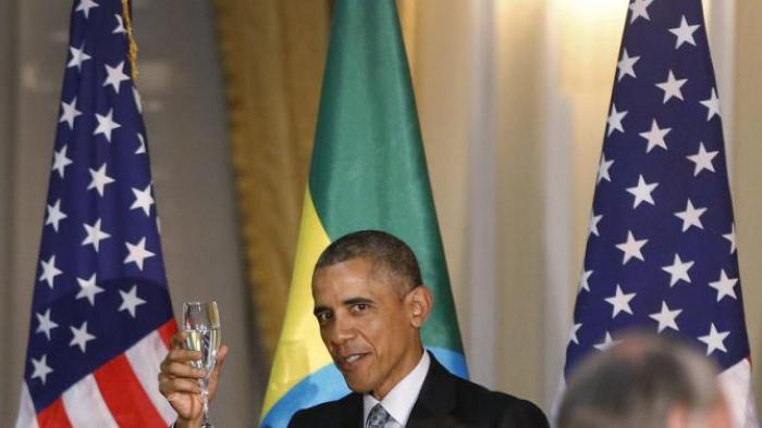 U.S. President Barack Obama raises his glass in a toast during a State Dinner in his honor at the National Palace in Addis Ababa, Ethiopia July 27, 2015. REUTERS/Jonathan Ernst
