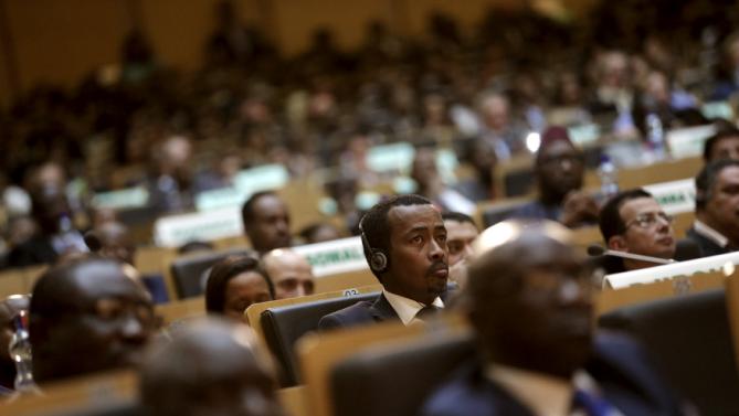Delegates listen to remarks by U.S. President Barack Obama at the African Union in Addis Ababa, Ethiopia July 28, 2015. Obama toured a U.S.-supported food factory in Ethiopia on Tuesday on the last leg of an Africa trip, before winding up his visit at the African Union where he will become the first U.S. president to address the 54-nation body.  REUTERS/Jonathan Ernst