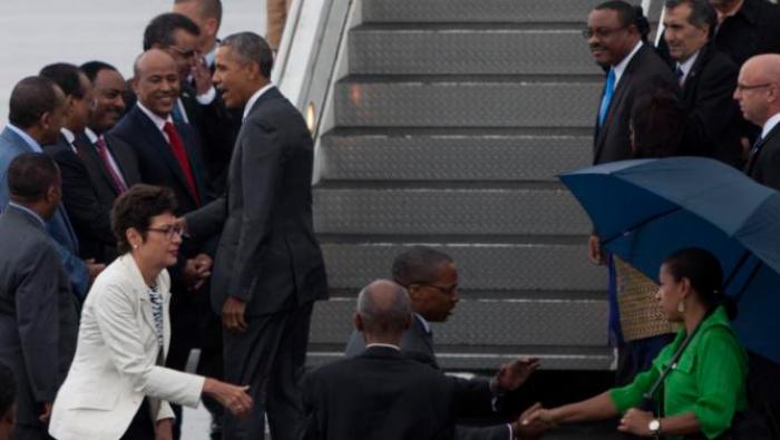US President Barack Obama, centre left, shakse hands with members of the Ethiopian delegation as he departs Bole International Airport, Tuesday, July 28, 2015, in Addis Ababa, on the final day of his visit in Ethiopia. Closing a historic visit to Africa, President Barack Obama on Tuesday urged the continent's leaders to prioritize creating jobs and opportunity for the next generation of young people or risk sacrificing future economic potential to further instability and disorder. (AP Photo/Sayyid Azim)