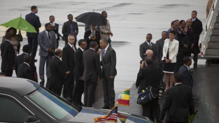 US President Barack Obama, centre, shakes hands with members of the Ethiopian delegation as he departs Bole International Airport, Tuesday, July 28, 2015, in Addis Ababa, on the final day of his visit in Ethiopia. Closing a historic visit to Africa, President Barack Obama on Tuesday urged the continent's leaders to prioritize creating jobs and opportunity for the next generation of young people or risk sacrificing future economic potential to further instability and disorder. (AP Photo/Sayyid Azim)