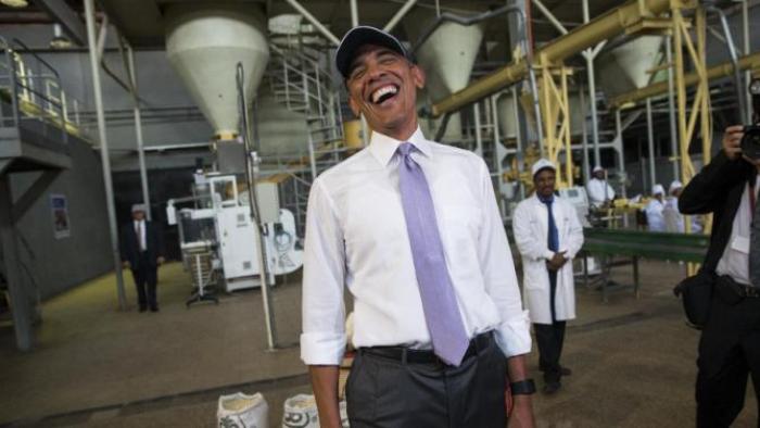 U.S. President Barack Obama jokes with the media during a tour of Faffa Food, Tuesday, July 28, 2015, in Addis Ababa, Ethiopia. On the final day of his African trip, Obama is focusing on economic opportunities and African security. (AP Photo/Evan Vucci)