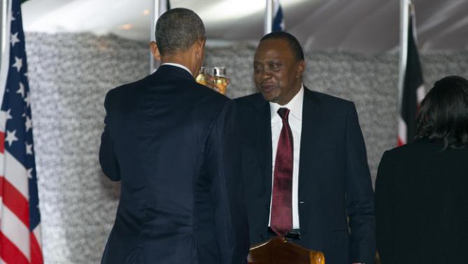 President Barack Obama, left, and Kenyan President Uhuru Kenyatta toast during a state dinner at State House, on Saturday, July 25, 2015, in Nairobi, Kenya. (AP Photo/Evan Vucci)