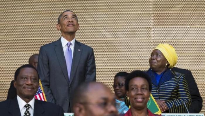 African Union Commission chairperson, Dr. Nkosazana Dlamini-Zuma, right, stands with U.S. President Barack Obama as he looks up at the crowd before delivering a speech to the African Union, Tuesday, July 28, 2015, in Addis Ababa, Ethiopia. On the final day of his African trip, Obama is focusing on economic opportunities and African security. (AP Photo/Evan Vucci)