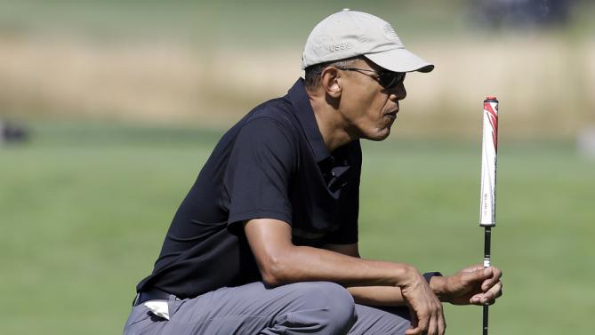 President Barack Obama golfs Monday, Aug. 10, 2015, at Vineyard Golf Club, in Edgartown, Mass., on the island of Martha's Vineyard. The president is staying on Martha's Vineyard with first lady Michelle Obama and daughter Sasha for a 17-day island retreat. (AP Photo/Steven Senne)