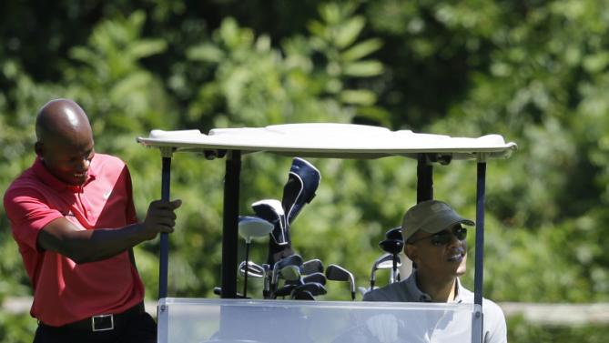 NBA Basketball player Ray Allen, left, steps into a golf cart driven by President Barack Obama while, golfing Wednesday, Aug. 12, 2015, at Farm Neck Golf Club, in Oak Bluffs, Mass., on the island of Martha's Vineyard. The president, first lady Michelle Obama, and daughter Sasha are vacationing on the island. (AP Photo/Steven Senne)