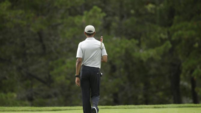 President Barack Obama walks on a green while golfing Sunday, Aug. 23, 2015, at Farm Neck Golf Club, in Oak Bluffs, Mass., on the island of Martha's Vineyard. The president spent most of his two-week summer vacation on the golf course, at the beach, and dining out with his family. (AP Photo/Steven Senne)