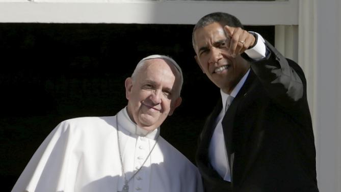President Barack Obama points out some of the highlights on the Washington Mall to Pope Francis from the Truman Balcony of the White House in Washington, Wednesday, Sept. 23, 2015 during a state arrival ceremony. (AP Photo/Pablo Martinez Monsivais)