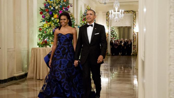 President Barack Obama and first lady Michelle Obama arrive at the 2015 Kennedy Center Honors reception in the East Room of the White House in Washington, Sunday, Dec. 6, 2015. (AP Photo/Jacquelyn Martin)