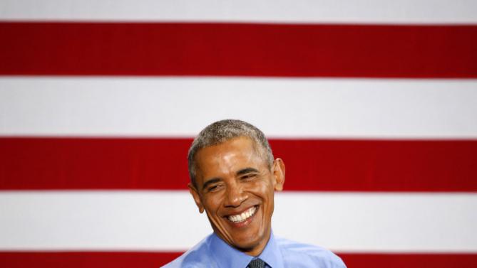 President Barack Obama smiles while speaking at the United Auto Workers-General Motors Center for Human Resources, Wednesday, Jan. 20, 2016 in Detroit. While in Detroit the president visited the 2016 North American International Auto Show and speak of the progress made by the city, its people and neighborhoods, and the American auto industry. (AP Photo/Paul Sancya)
