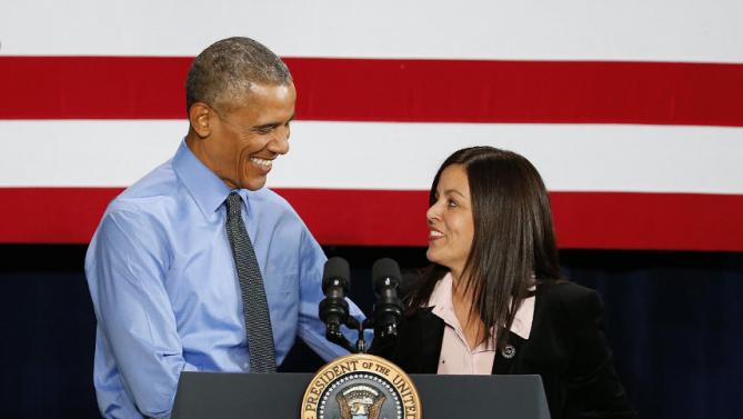 President Barack Obama is introduced by United Auto Workers Vice President Cindy Estrada at the UAW-General Motors Center for Human Resources, Wednesday, Jan. 20, 2016 in Detroit. While in Detroit the president is scheduled to visit the 2016 North American International Auto Show and speak of the progress made by the city, its people and neighborhoods, and the American auto industry. (AP Photo/Paul Sancya)