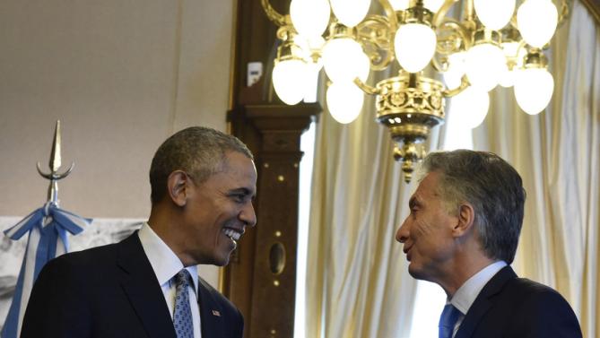Argentina's President Mauricio Macri (R) and U.S. President Barack Obama talk at the Casa Rosada government house in Buenos Aires in this March 23, 2016 handout photo by the Argentine Presidency. REUTERS/Argentine Presidency/Handout via Reuters ATTENTION EDITORS - THIS PICTURE WAS PROVIDED BY A THIRD PARTY. REUTERS IS UNABLE TO INDEPENDENTLY VERIFY THE AUTHENTICITY, CONTENT, LOCATION OR DATE OF THIS IMAGE. THIS PICTURE IS DISTRIBUTED EXACTLY AS RECEIVED BY REUTERS, AS A SERVICE TO CLIENTS. FOR EDITORIAL USE ONLY. NOT FOR SALE FOR MARKETING OR ADVERTISING CAMPAIGNS.