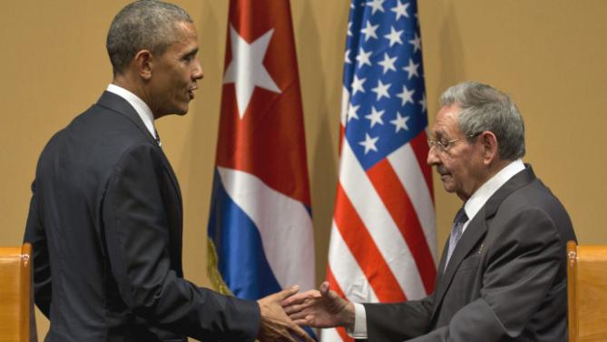 US President Barack Obama and Cuba's President Raul Castro shake hands after a joint statement in Havana, Cuba, Monday, March 21, 2016. Brushing past differences, President Obama and President Castro sat down for a historic meeting, offering critical clues about whether Obama's sharp U-turn in policy will be fully reciprocated.(AP Photo/Ramon Espinosa)