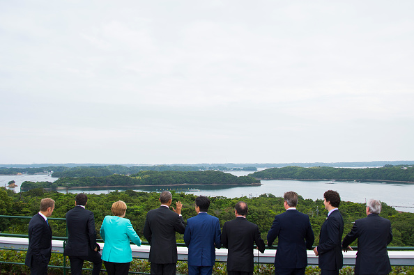 (From L) European Council President Donald Tusk, Italian Prime Minister Matteo Renzi, German Chancellor Angela Merkel, US President Barack Obama, Japanese Prime Minister Shinzo Abe, French President Francois Hollande, British Prime Minister David Cameron, Canadian Prime Minister Justin Trudeau and European Commission President Jean-Claude Juncker look at the view after posing for the family photo during the first day of the Group of Seven (G7) summit meetings in Ise city on May 26, 2016. World leaders kick off two days of G7 talks in Japan on May 26 with the creaky global economy, terrorism, refugees, China's controversial maritime claims, and a possible Brexit headlining their packed agenda. / AFP / AFP POOL / JIM WATSON (Photo credit should read JIM WATSON/AFP/Getty Images)