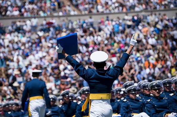 Cadets celebrate during a graduation ceremony at the US Air Force Academy's Falcon Stadium June 2, 2016 in Colorado Springs, Colorado. US President Barack Obama gave the commencement speech at the academy. / AFP / Brendan Smialowski (Photo credit should read BRENDAN SMIALOWSKI/AFP/Getty Images)