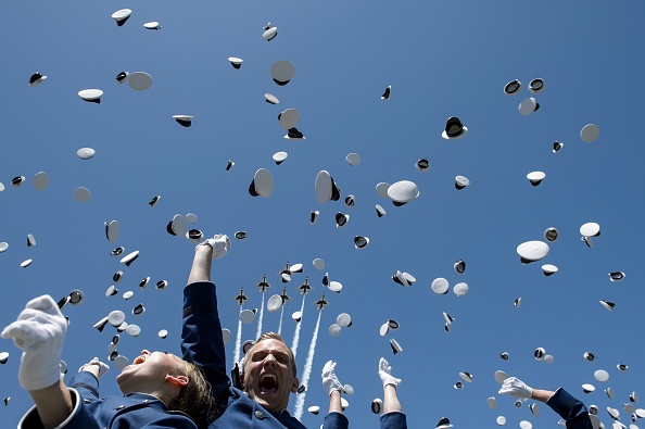 Cadets celebrate after taking their oath during a graduation ceremony at the US Air Force Academy's Falcon Stadium June 2, 2016 in Colorado Springs, Colorado. US President Barack Obama gave the commencement speech at the academy. / AFP / Brendan Smialowski (Photo credit should read BRENDAN SMIALOWSKI/AFP/Getty Images)