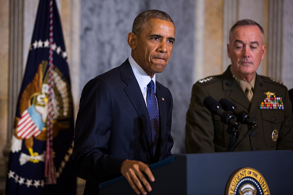 WASHINGTON, DC - JUNE 14: (AFP-OUT)US President Barack Obama (L) speaks on the Orlando shooting at the Treasury Department while Chairman of the Joint Chiefs of Staff General Joseph Dunford (R) look on, on June 14, 2016 in Washington, DC. Obama directly attacked Donald Trump's proposal to ban Muslims from entering the United States. (Photo by Jim Lo Scalzo-Pool/Getty Images)
