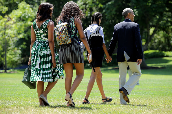 WASHINGTON, DC - JUNE 17: (L-R) U.S. first lady Michelle Obama, daughters Sasha Obama and Malia Obama, and President Barack Obama leave the White House before boarding Marine Oe on the South Lawn June 17, 2016 in Washington, DC. The first family is traveling to New Mexico and tour Carlsbad Caverns National Park to celebrate the 100th anniversary of the creation of America's national park system. (Photo by Chip Somodevilla/Getty Images)