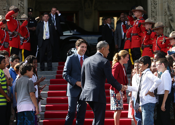 Justin Trudeau, Canada's prime minister, center left, and U.S. President Barack Obama, center right, greet school children outside of Parliament Hill after the North American Leaders Summit (NALS) in Ottawa, Ontario, Canada, on Wednesday, June 29, 2016. Leaders from the three Nafta nations "agree on the need for governments of all major steel-producing countries to make strong and immediate commitments to address the problem of global excess steelmaking capacity," according to a statement from Trudeau. Photographer: Cole Burston/Bloomberg via Getty Images