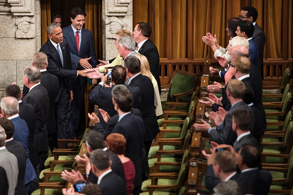 US President Barack Obama (L) arrives with Canadian Prime Minister Justin Trudeau (2L) to address Parliament in the House of Commons Chamber on Parliament Hill while attending the North American Leaders Summit on June 29, 2016 in Ottawa, Ontario. / AFP / Brendan Smialowski (Photo credit should read BRENDAN SMIALOWSKI/AFP/Getty Images)