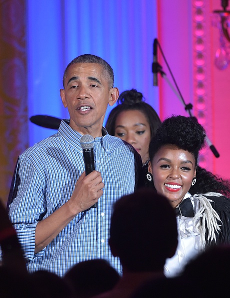 US President Barack Obama speaks beside singer Janelle Monáe (R) during an Independence Day Celebration for military members and administration staff on July 4, 2016 in the East Room of the White House in Washington, DC. / AFP / Mandel NGAN (Photo credit should read MANDEL NGAN/AFP/Getty Images)