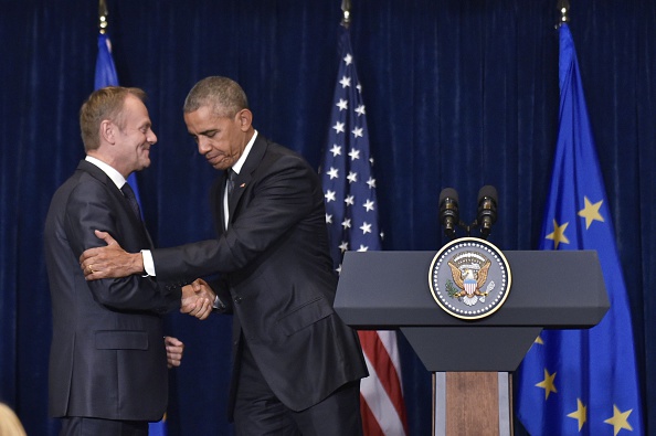 US President Barack Obama (R) shakes hands with European Council President Donald Tusk following a meeting on the sidelines of the NATO Summit at a hotel in Warsaw on July 8, 2016. The Polish capital hosts a two-day NATO summit, the first time ever that it hosts a top-level meeting of the Western military alliance which it joined in 1999. / AFP / MANDEL NGAN (Photo credit should read MANDEL NGAN/AFP/Getty Images)