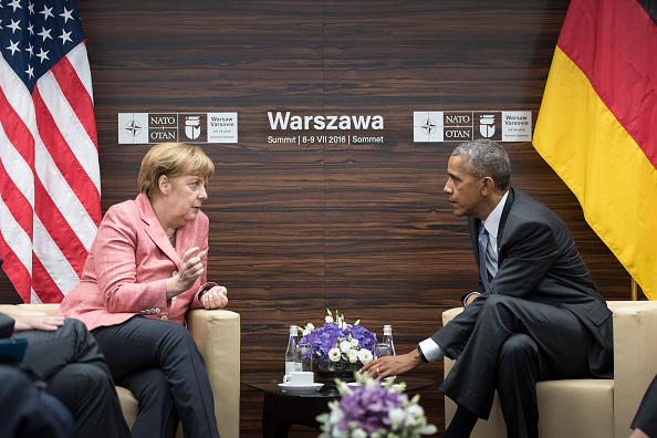 WARSAW, POLAND - JULY 09: In this handout photo provided by the German Government Press Office (BPA), German Chancellor Angela Merkel and President Barack Obama meet for talks during the Warsaw NATO Summit on July 9, 2016 in Warsaw, Poland. NATO member heads of state, foreign ministers and defense ministers are gathering for a two-day summit that will end later today. (Photo by Guido Bergmann/Bundesregierung via Getty Images)